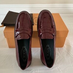 Tod's Burgundy Patent Leather Penny Loafers